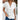 Woman wearing a white textured short sleeve t-shirt in a casual loose fit, breathable fabric, size 2XL.