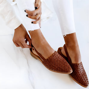 Women's dark brown woven leather loafers, stylish slip-ons with elegant design, suitable for fashion-conscious individuals.