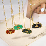 Luxury emerald necklace with a green gemstone pendant on a gold chain.