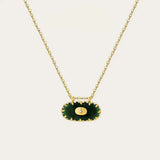 YA-CHAN Green Gemstone Pendant Gold Chain - Luxury Emerald Necklace featuring a vibrant green gemstone set in a circular gold pendant on a delicate gold chain.
