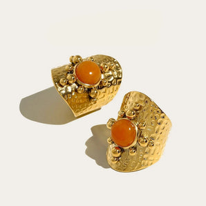 YA-CHAN textured gold statement earrings with an artisan design, featuring a bold and artistic look in a golden hue.