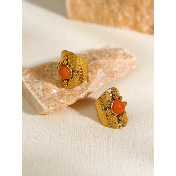 Gold statement earrings with textured design, crafted by YA-CHAN, displayed on a white background.