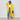 Yellow oversized cable knit cardigan for women, featuring a cozy texture and loose fit, shown in size 2XL. The cardigan has a prominent collar, long sleeves, and extends to the thighs, styled over a pair of denim pants.