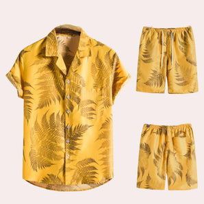 Yellow Fern Print Men's Tropical Shirt & Shorts Set in 3XL, featuring a vibrant gold and yellow pattern with a collared shirt, short sleeves, and coordinated shorts, ideal for summer beachwear.