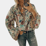 Yellow floral boho blouse for women featuring balloon sleeves and a V-neck design, shown in apricot color and size 3XL.