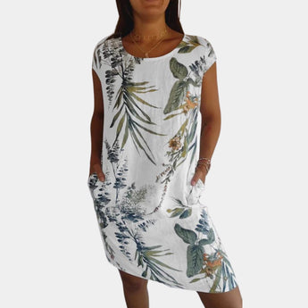 Yellow floral tropical print women's summer dress with pockets, featuring short sleeves and a knee-length hem, designed for a 3XL size.
