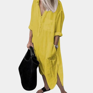 Yellow linen V-neck long sleeve midi dress with pockets, displayed on a mannequin, showcasing its relaxed fit and elegant design suitable for a 3XL size.
