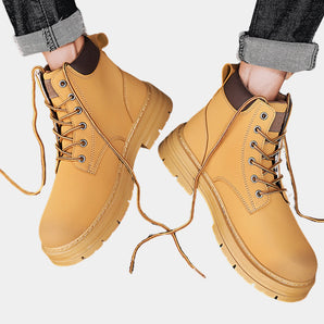 Yellow waterproof men's ankle boots designed for durability and non-slip performance, suitable for workwear.