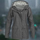 Gray 5XL waterproof and windproof hoodie jacket featuring an adjustable hood, long sleeves, and a high neck collar, designed for outerwear protection.