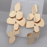 Gold Petal Geometric Drop Earrings with beige and gold patterns, featuring circular design elements, ideal for chic wedding and evening wear.