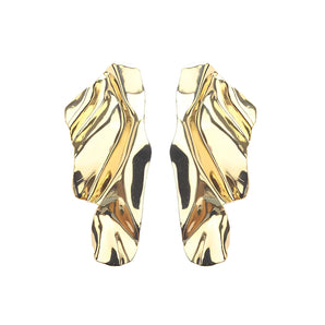 Gold shell earrings with unique ocean-inspired abstract design, featuring a metallic finish and elegant artful shapes.