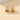 Gold Spiral Earrings featuring a modern, multi-loop design, showcasing luxury and intricate craftsmanship in designer jewelry.