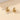 Gold Spiral Earrings featuring modern, luxury, multi-loop design in gold metal, resembling spirals and circles, high-end designer jewelry.