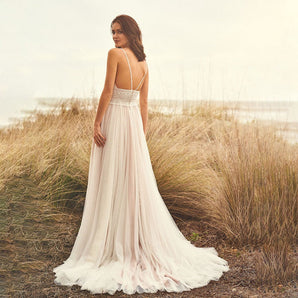 Timeless wedding dress with lace appliqués
